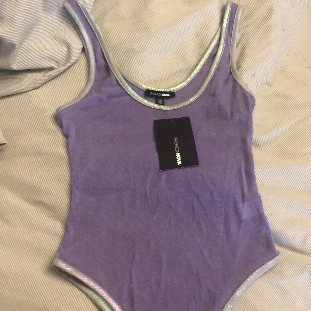 A lavender shimmer and silver bodysuit